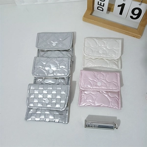 Quilted mini storage pouches in silver, white and pink colors with heart and grid patterns