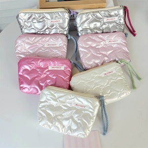Quilted heart pattern PU leather cosmetic bags with metallic finish and wristlet straps