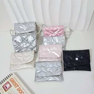 Close-up of quilted PU leather mini storage pouches with heart and star stitching details