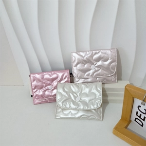 Glossy heart-quilted PU leather coin pouches in pink, lilac and white colors