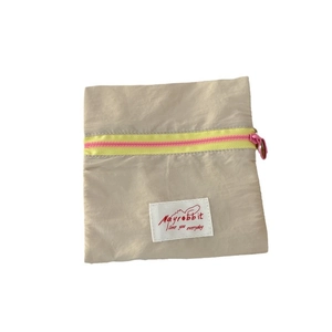 Minimalist canvas storage bag with macaron color contrast and pink zipper detail