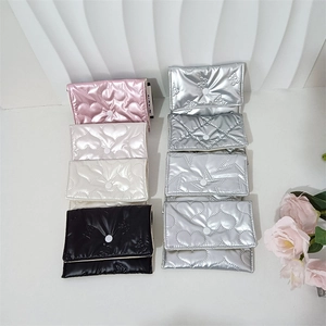 Quilted candy-colored pouches with heart and star patterns shown in a detailed flat lay