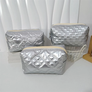 3-piece set of silver metallic quilted makeup bags with heart, check, and diamond patterns