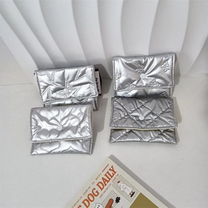 Chic silver quilted pouch set featuring star heart and bow patterns with metallic finish