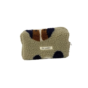Sherpa fleece cosmetic bag with navy and brown patchwork design and zipper closure