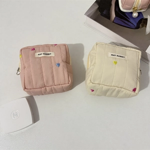 Quilted makeup bag set with colorful heart embroidery and secure zipper closure