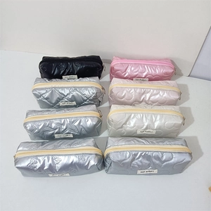 Quilted nylon zipper pouches with heart and star patterns in multiple metallic colors