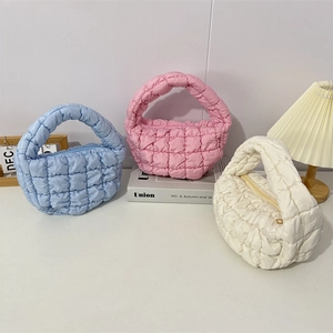 Puffy quilted mini cloud handbags in blue, pink and white with soft bubble texture