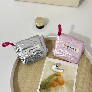 Quilted mini earphone case in silver and pink with mayrabbit label and wrist strap