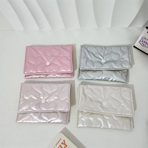 Quilted heart pattern cosmetic pouches in pink, silver, champagne and white with snap button