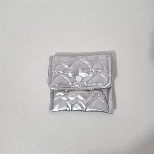 Silver PU leather pouch with heart quilting and round snap closure for small items