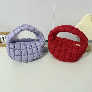 Stylish puffer quilted moon bags in purple and red with soft top handles and gold zippers