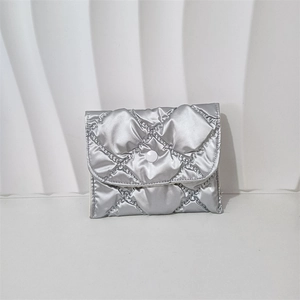 Macro view of silver quilted PU leather coin purse showing the snap closure and metallic texture