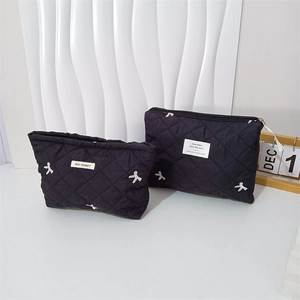 Black quilted makeup bag set with cute bow embroidery and zipper closure for women