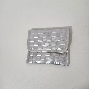 Close-up of a silver quilted PU storage pouch with checkered pattern and snap button