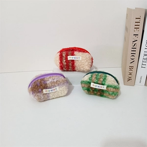Detailed plush shell bags in striped and patchwork patterns with soft lamb wool texture