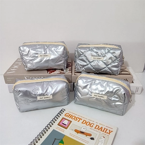Quilted silver PU makeup bag set with star, heart, and diamond patterns for travel