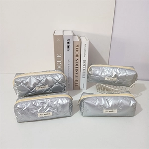 Chic silver quilted pencil case and makeup bag set with stylish geometric patterns