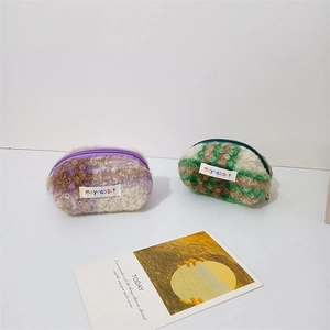 Fuzzy plaid shell-shaped plush coin purse with lamb wool texture and top zipper closure