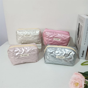 Quilted heart pattern PU makeup bags in metallic colors with secure zipper closure