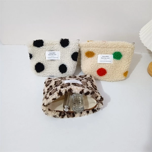 Plush leopard and polka dot makeup bags with zipper closure and soft faux fur texture