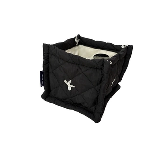 Quilted black storage basket with diamond pattern and white embroidery for home organization
