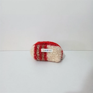 Detail of red and beige checkered teddy fleece coin purse with mayrabbit woven label