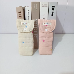 Quilted cotton storage pouches featuring colorful heart embroidery and button closure