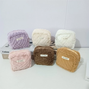 Set of six colorful plush mini bags featuring May Rabbit labels and soft fluffy texture