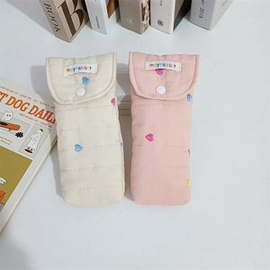 Quilted cotton storage pouches with heart embroidery in cream and pink colors