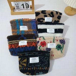 Fleece cosmetic storage bags in leopard and floral patterns for winter travel