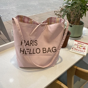 Pink canvas tote bag with Paris lettering print and plaid lining for travel