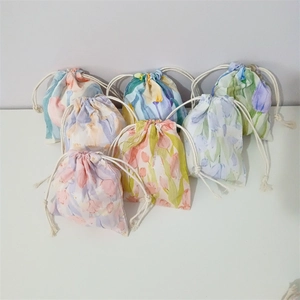 Floral cotton drawstring storage bags in various colors with elegant tulip patterns