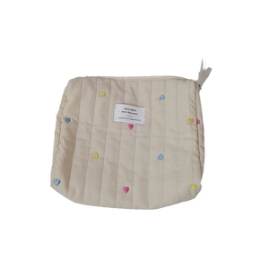 Quilted cream cosmetic bag with colorful heart embroidery and front logo patch