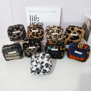 Detailed grid of plush lamb velvet cosmetic bags in diverse leopard and geometric patterns