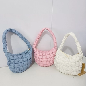 Detailed comparison of quilted cloud bags in light blue, soft pink, and ivory white colors