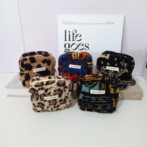 Set of five plush square storage bags with leopard and geometric patterns