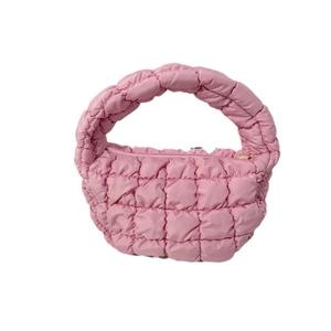 Pink quilted puffer handbag with a soft cloud-like texture and semi-circle design