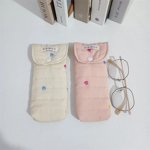 Quilted fabric storage pouch with heart embroidery and snap button for sunglasses