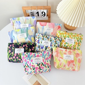 Floral canvas makeup bags with tulip prints and zipper closure in various colors