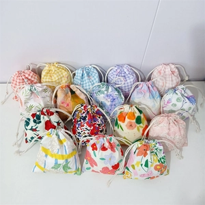 Floral cotton drawstring storage bags in various plaid and flower patterns for makeup