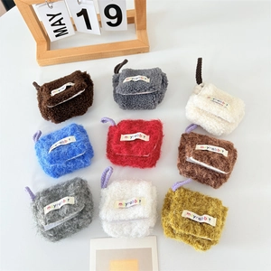 Collection of colorful plush mini earphone cases in various soft pastel shades