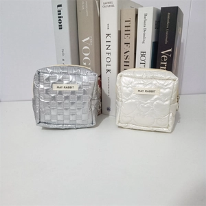 Quilted PU mini cosmetic bags in silver lattice and white heart patterns with zippers