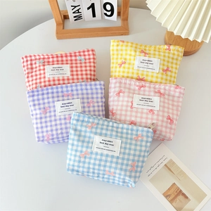 Five-piece set of checkered canvas cosmetic bags with pink bow print and zipper closure
