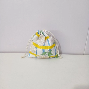 Close-up of drawstring closure on floral printed cotton organizer pouch with yellow stripes