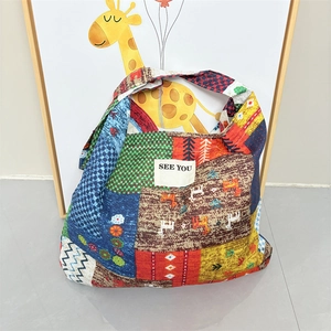 Ethnic style large patchwork canvas tote bag with floral patterns and 'SEE YOU' label