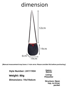 Detail view of denim crossbody bag showing 19x19x6cm size and red button decor