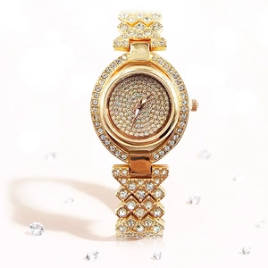 Luxury gold women's watch with oval dial and full rhinestone decoration on band