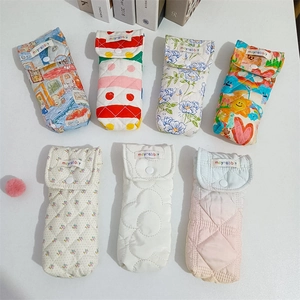 Detailed view of assorted quilted floral pouches for glasses and stationery with snap closure