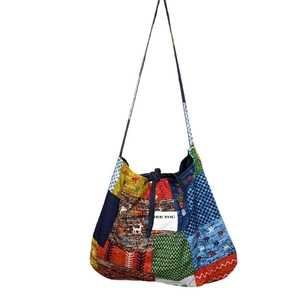 Bohemian patchwork denim tote bag with colorful ethnic patterns and SEE YOU text tag